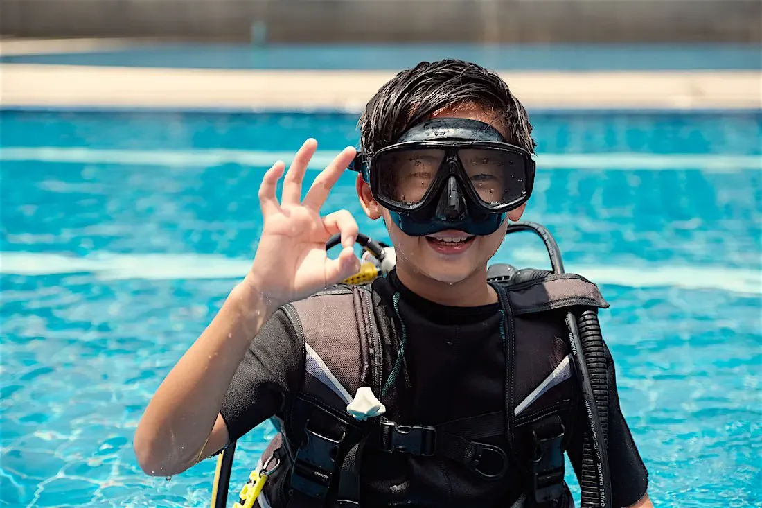 Child on a PADI Bubblemaker experience in the calm, shallow lagoon