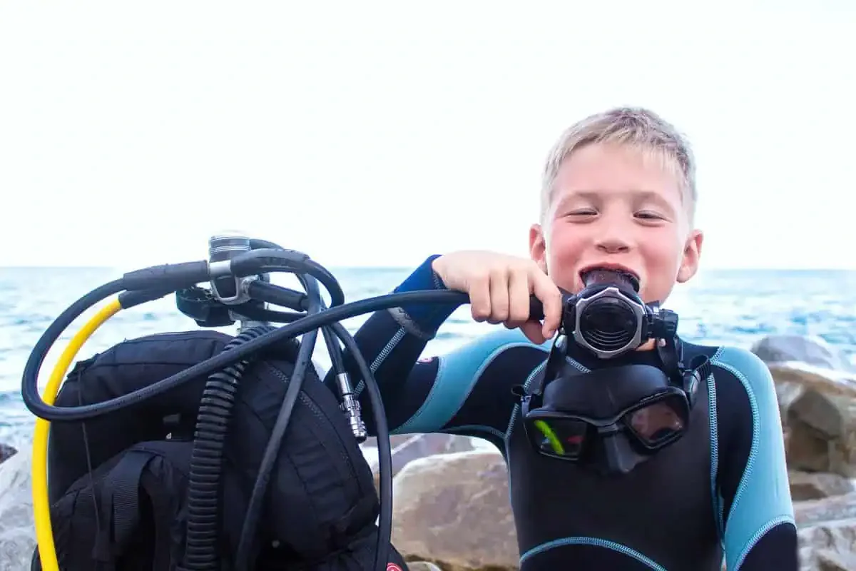 Child enjoying a PADI Bubblemaker scuba experience in the shallow lagoon